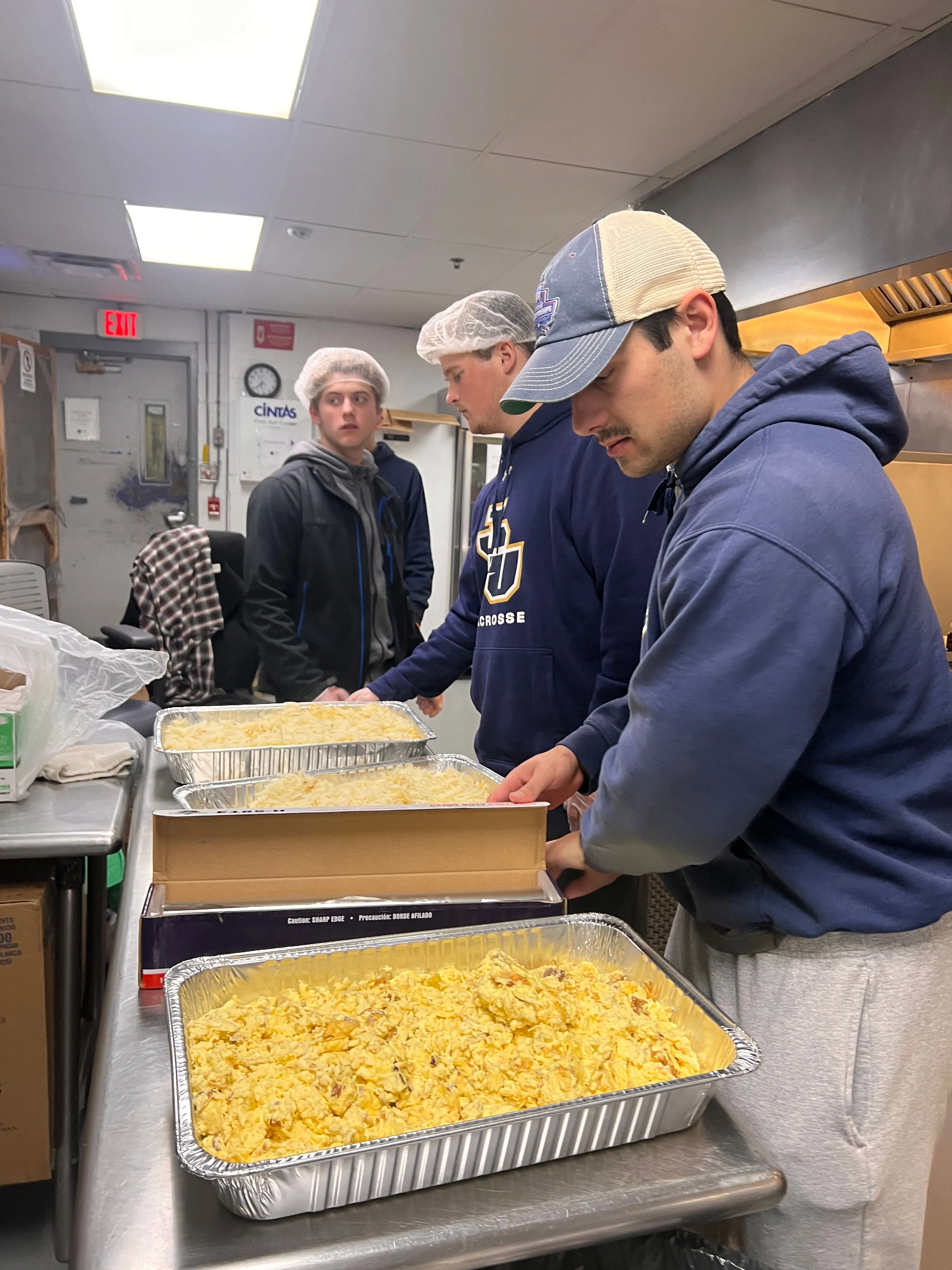 More Than Food volunteers and community members at a service event