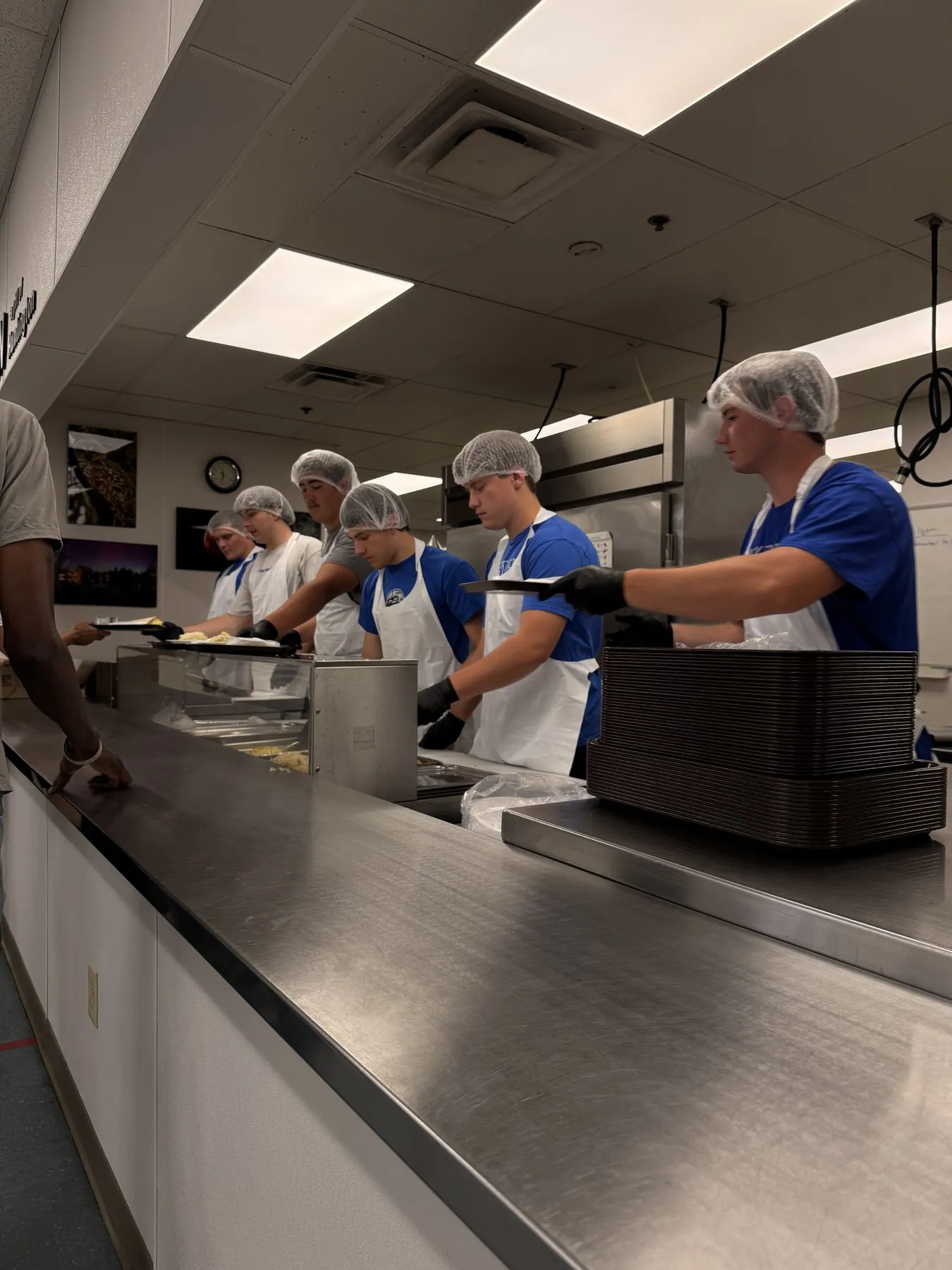 More Than Food volunteers and community members at a service event